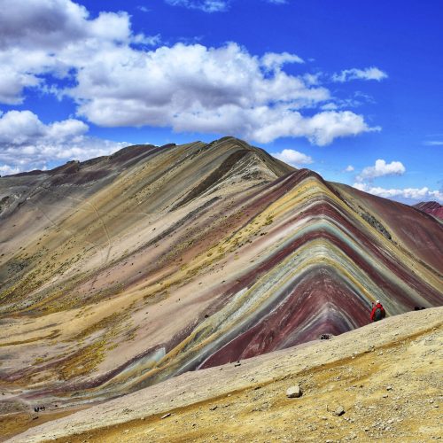 A vertical shot of the famous Rainbow Mountain in Uchullujllo, Peru during the daytime